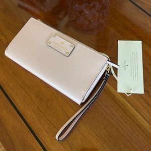 Kate Spade Wallet, never used.  Pink!  Smoke free, pet free home.